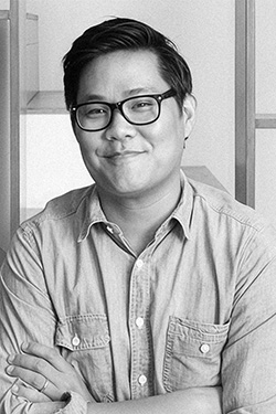 Headshot of Brian Won. Smiling man with glasses.